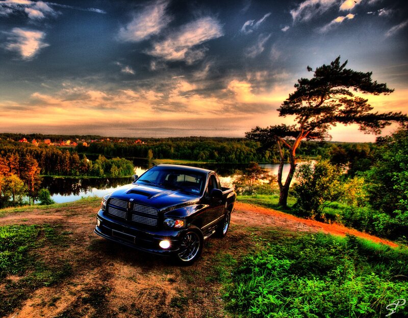 Black truck on a hill at sunset