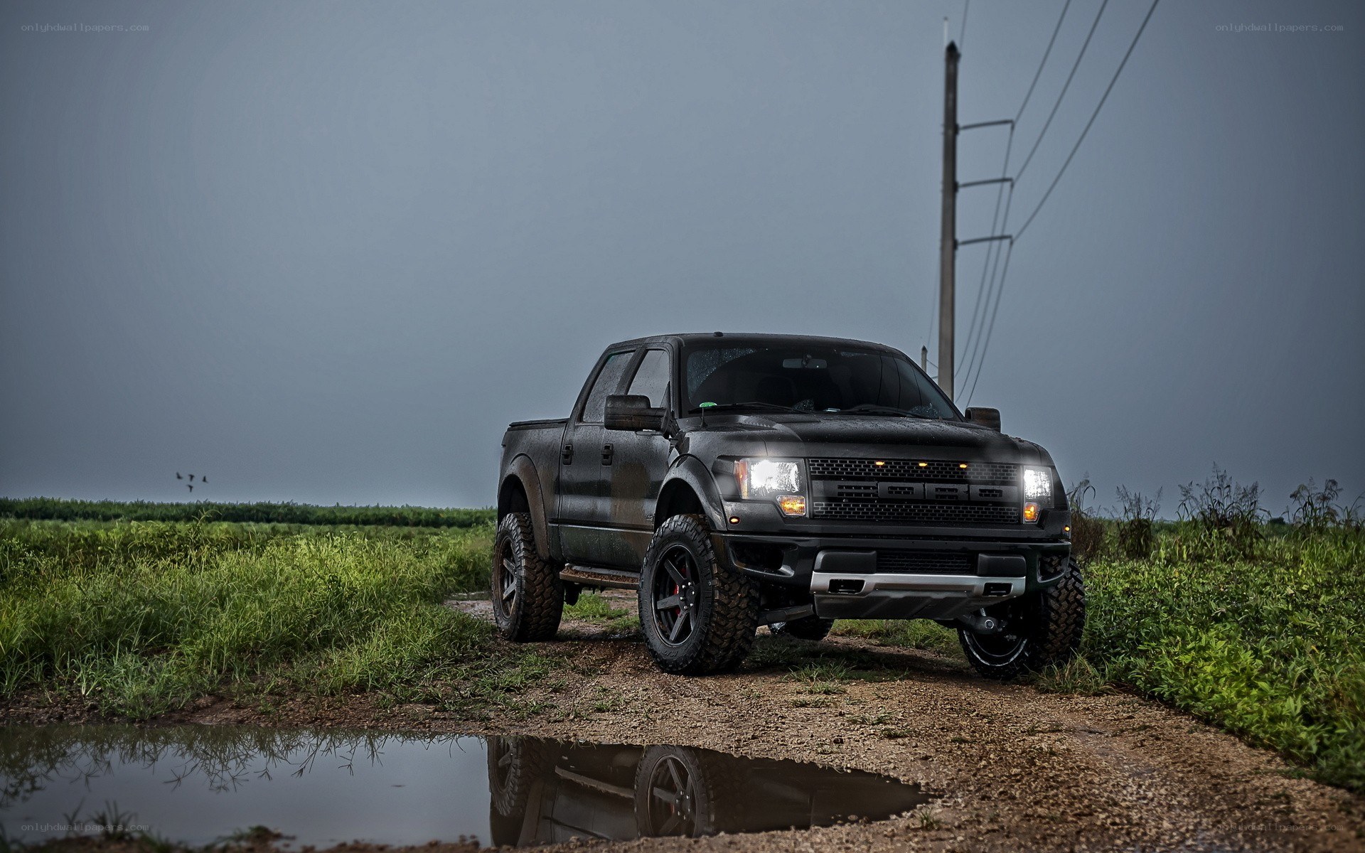black truck on dirt road