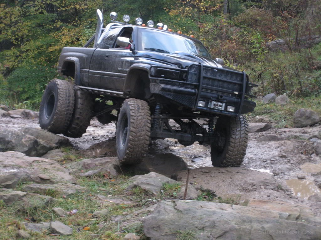 Black truck on rocky terrain