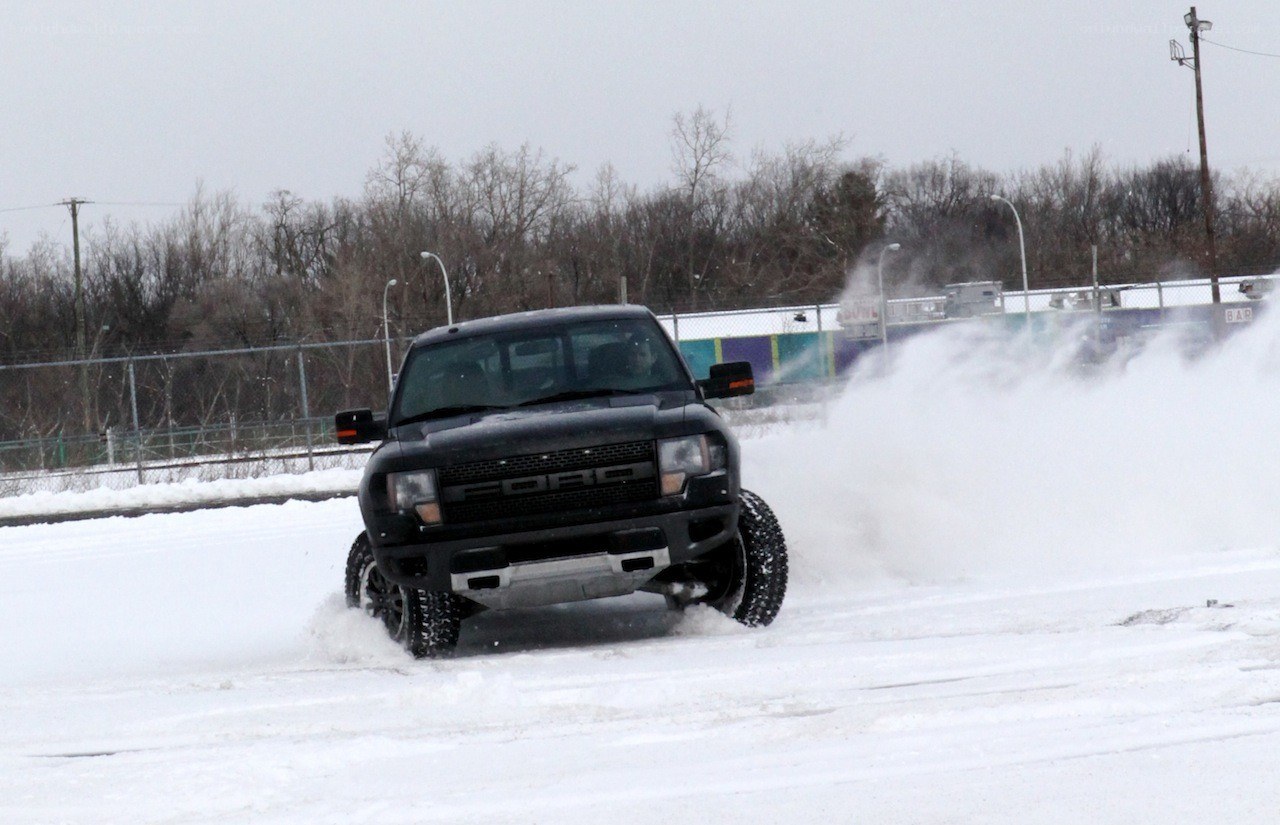 Black truck on snowy track