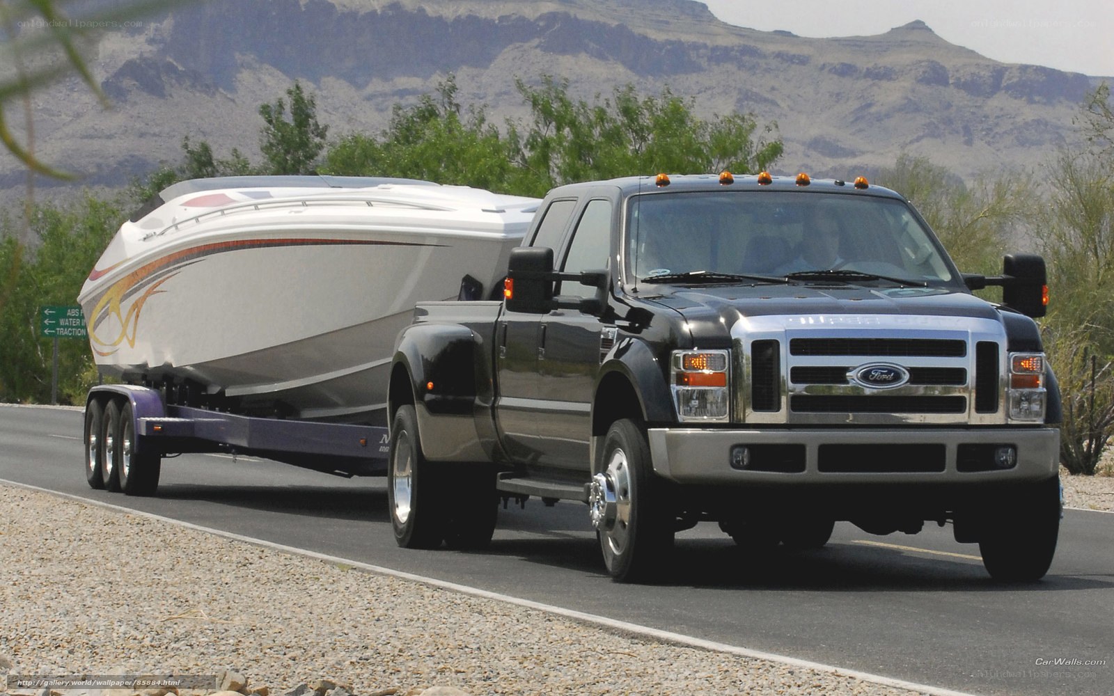 black truck towing boat