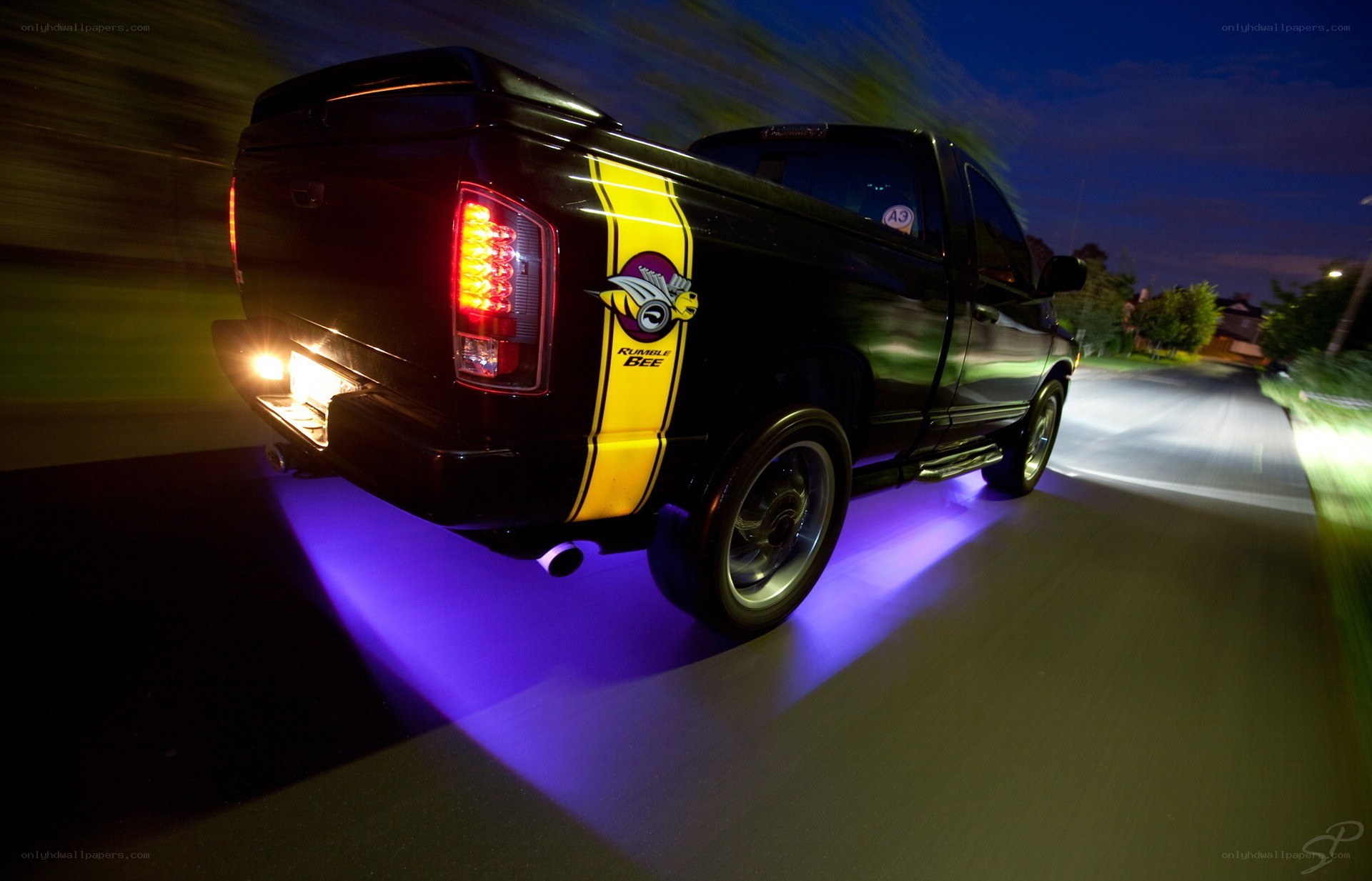 Black truck with purple underglow