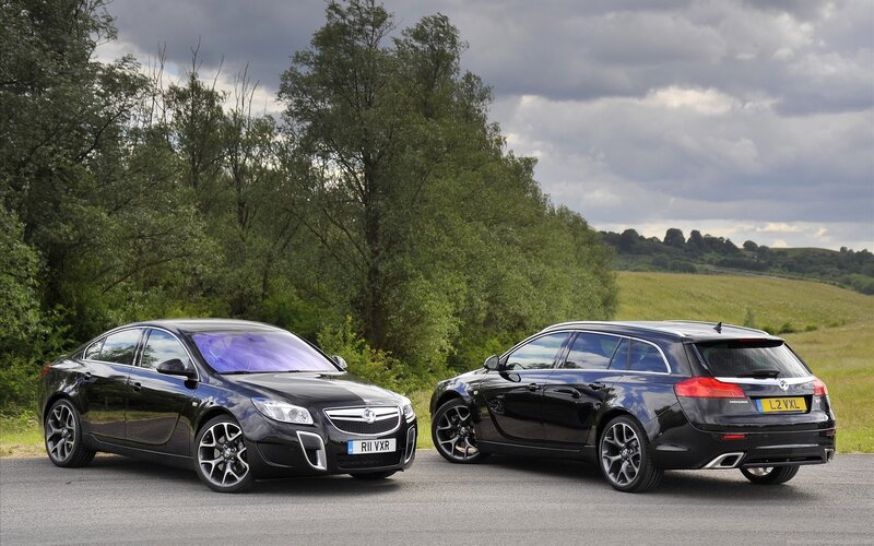 Black Vauxhall cars on road