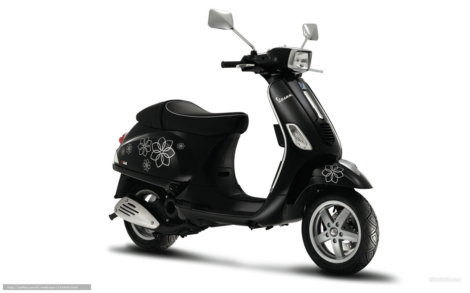 Black Vespa scooter with floral decals
