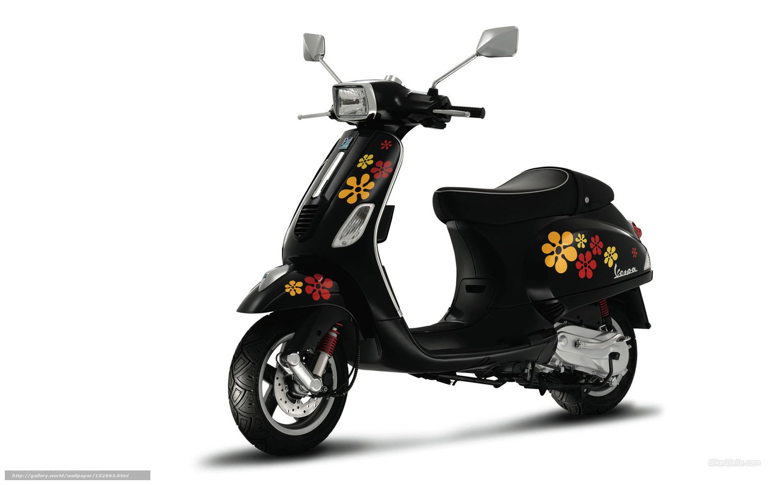Black Vespa scooter with floral decals