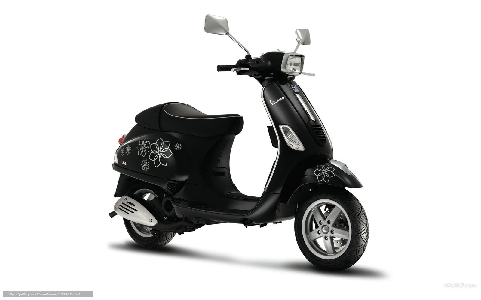 Black Vespa scooter with floral decals