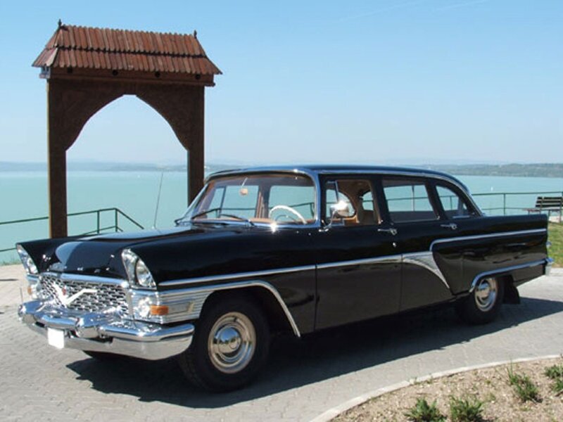 Black vintage car by the lake
