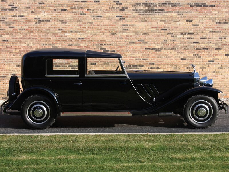 Black Vintage Car — Calm, Afternoon, Photograph, Brick Wall, Grass