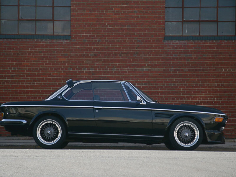 Black Vintage Car — Calm, Afternoon, Photograph, Brick Wall, Windows