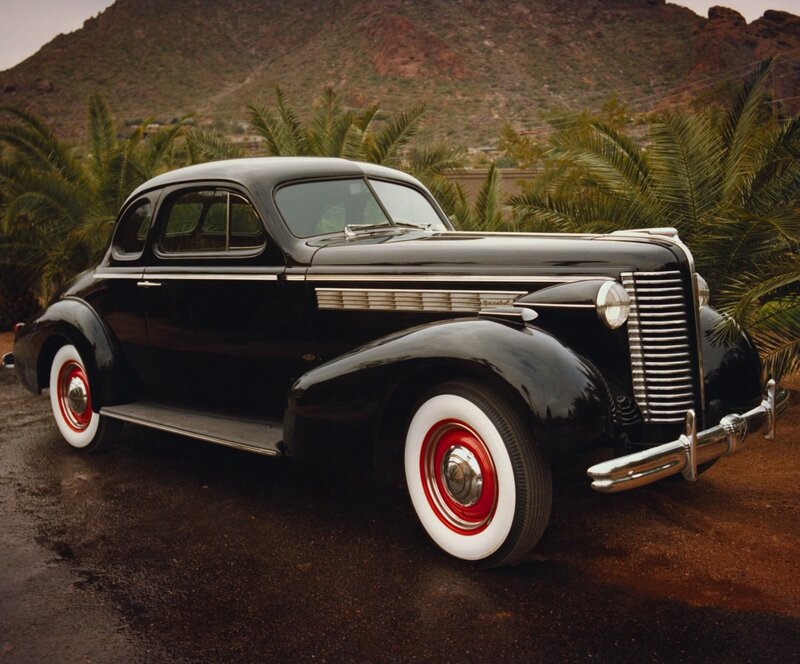 Black vintage car in desert