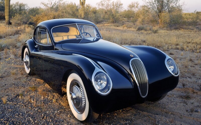 Black vintage car in desert