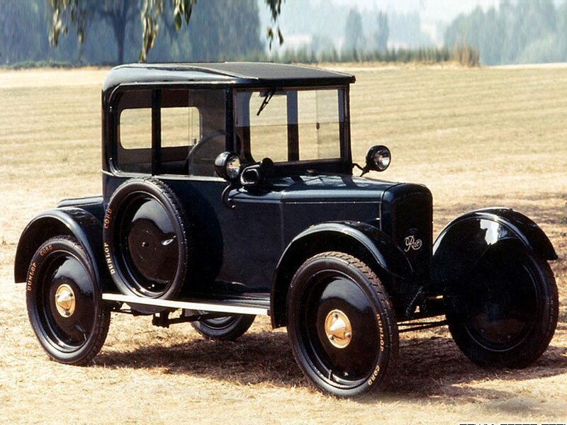 Black vintage car in field