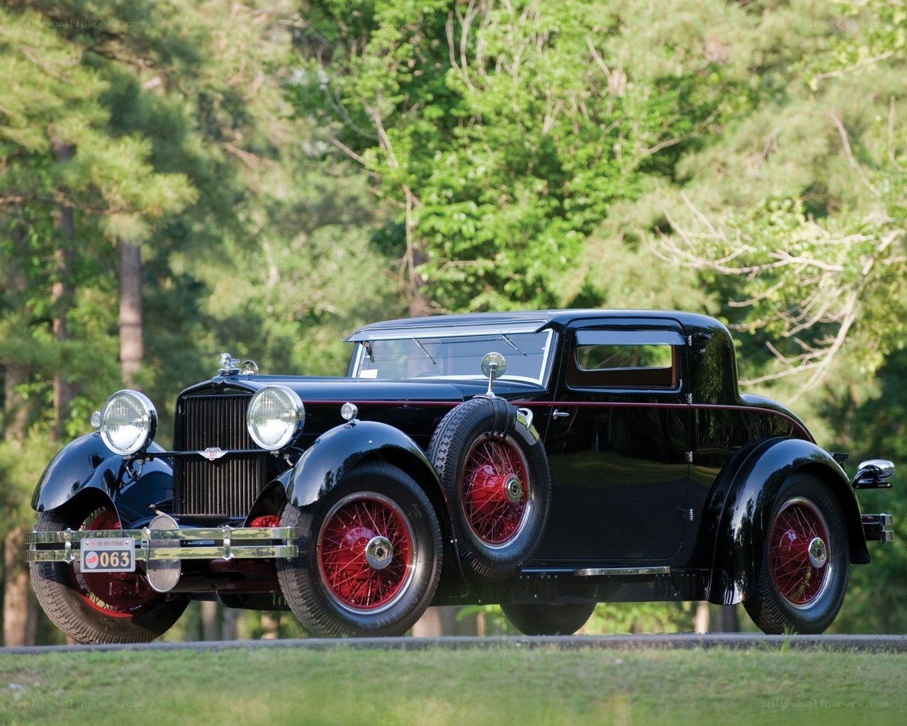 Black vintage car in forest