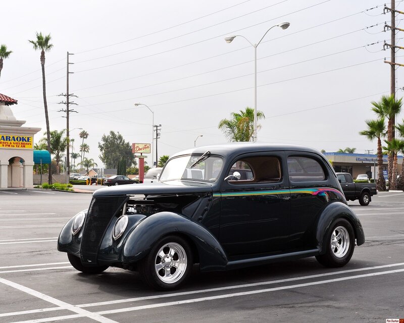 Black vintage car in parking lot