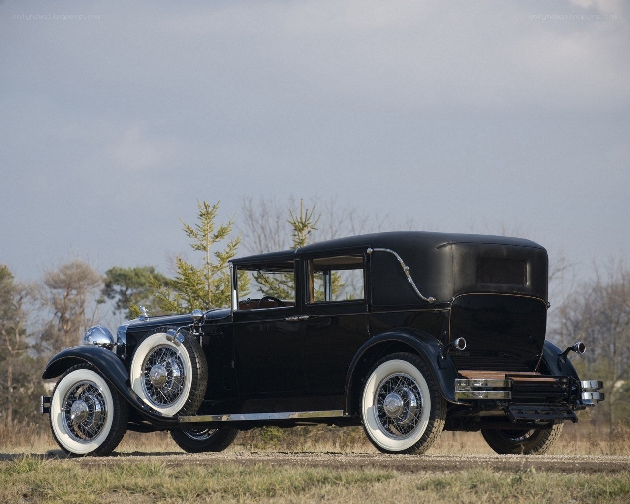 Black vintage car on a field