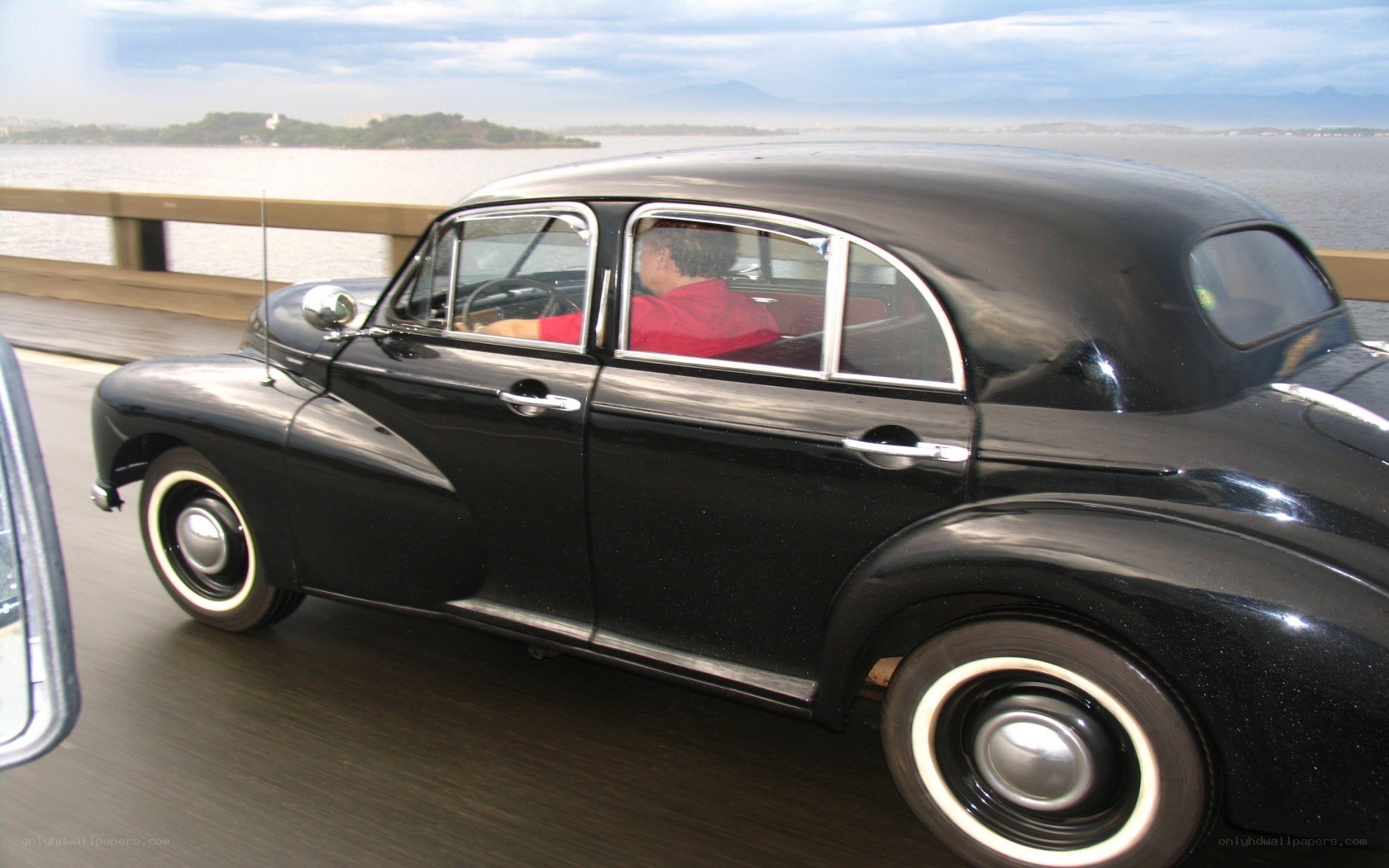 Black vintage car on bridge