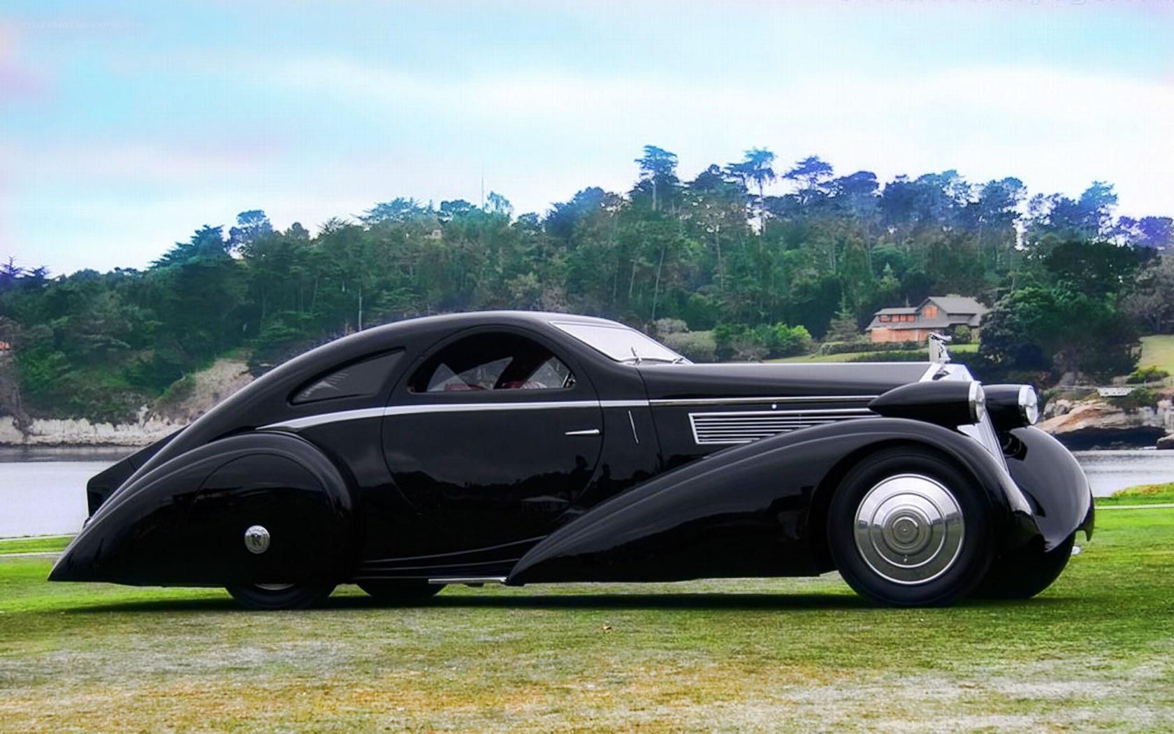 Black vintage car on grass