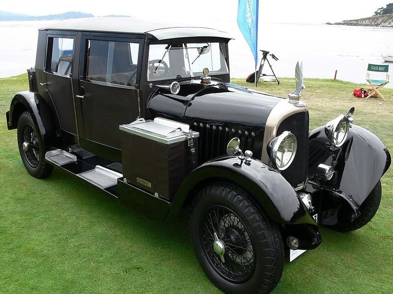 Black vintage car on grass