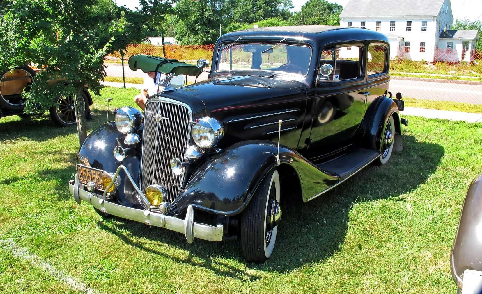 Black vintage car on grass