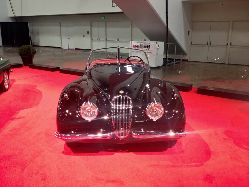 Black vintage car on red carpet