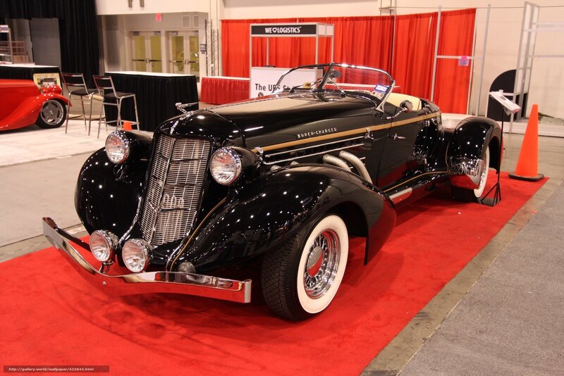 Black vintage car on red carpet