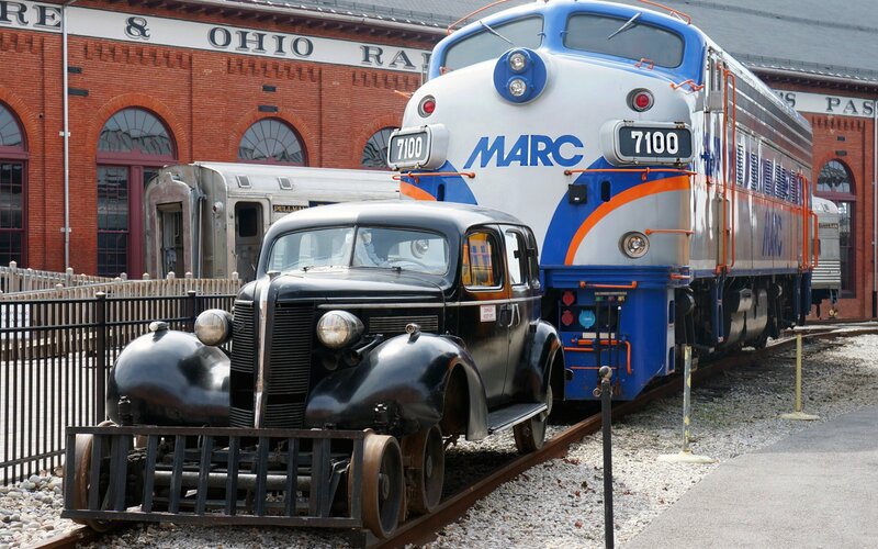 Black Vintage Car on Tracks