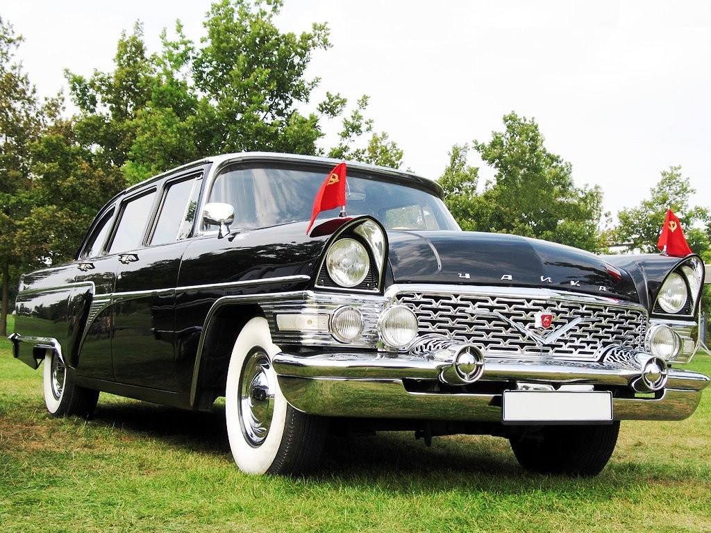 Black vintage car with flags