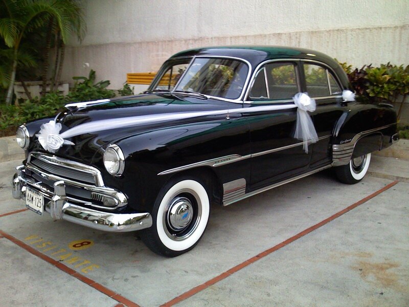 Black vintage car with wedding decorations