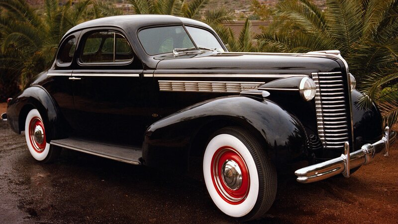 Black vintage car with white walls