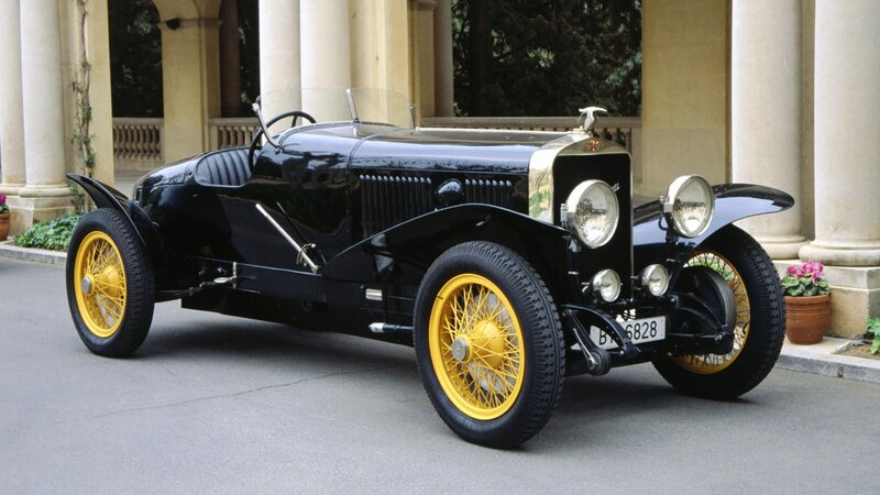Black vintage car with yellow wheels