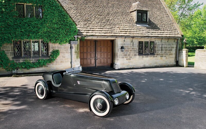 Black Vintage Race Car — Serene, Afternoon, Photograph, Stone Building