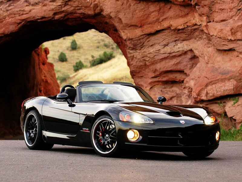 Black Viper sports car under rock arch