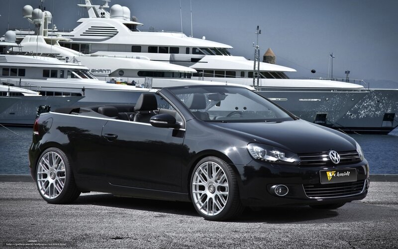 Black Volkswagen convertible at marina