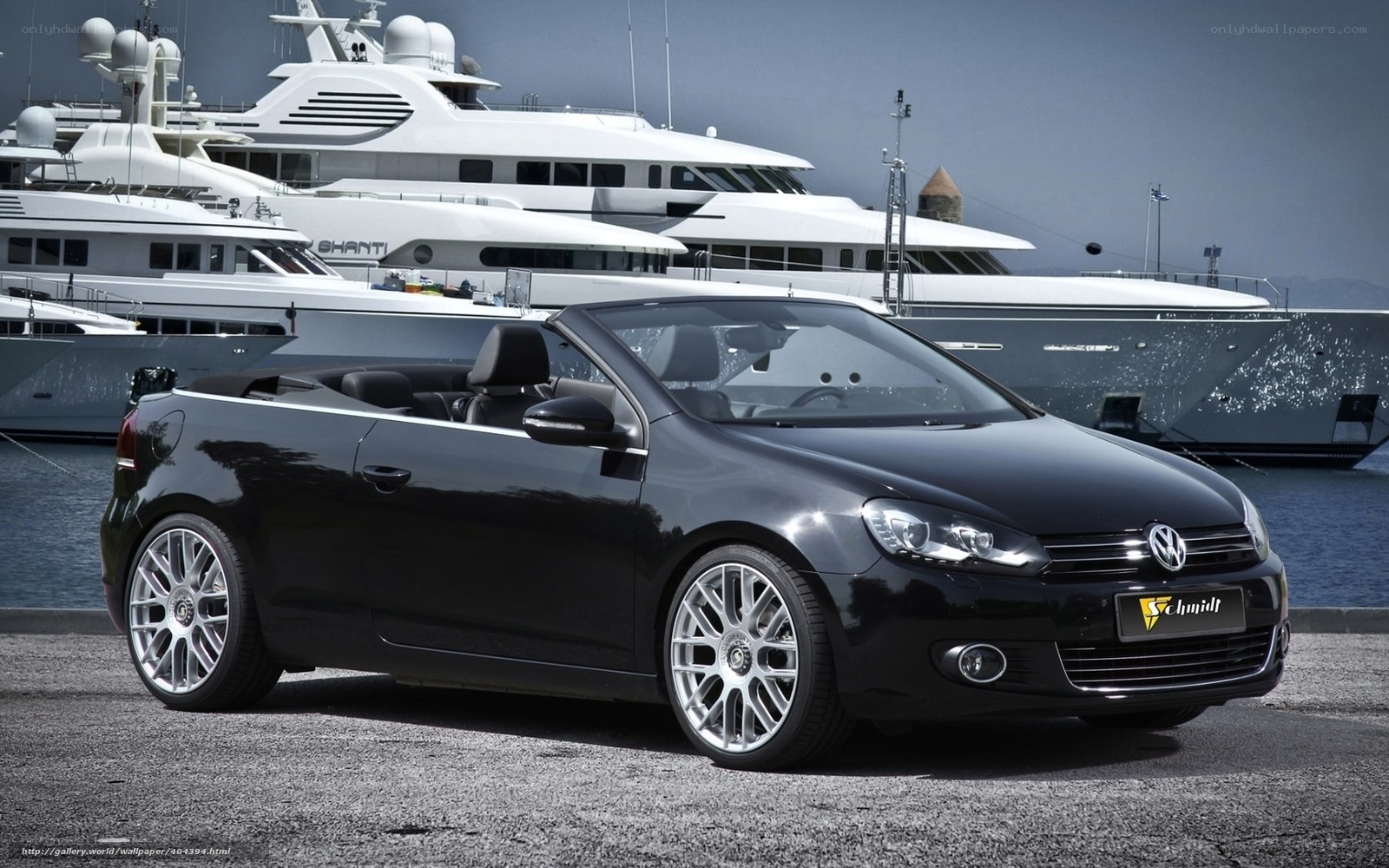 Black Volkswagen convertible at marina