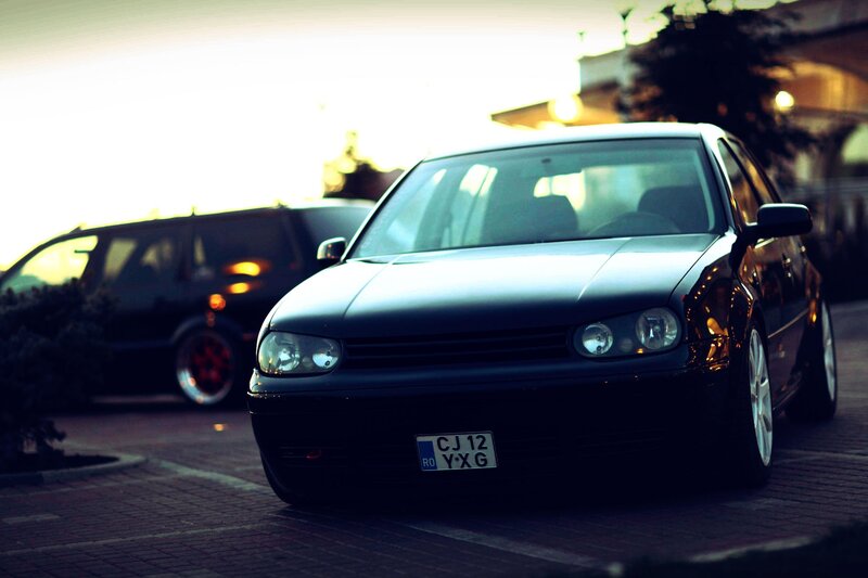 Black Volkswagen Golf — Dramatic, Sunset