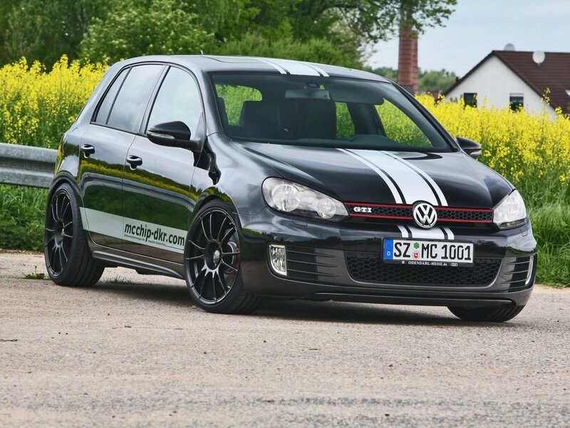 Black Volkswagen Golf GTI with racing stripes
