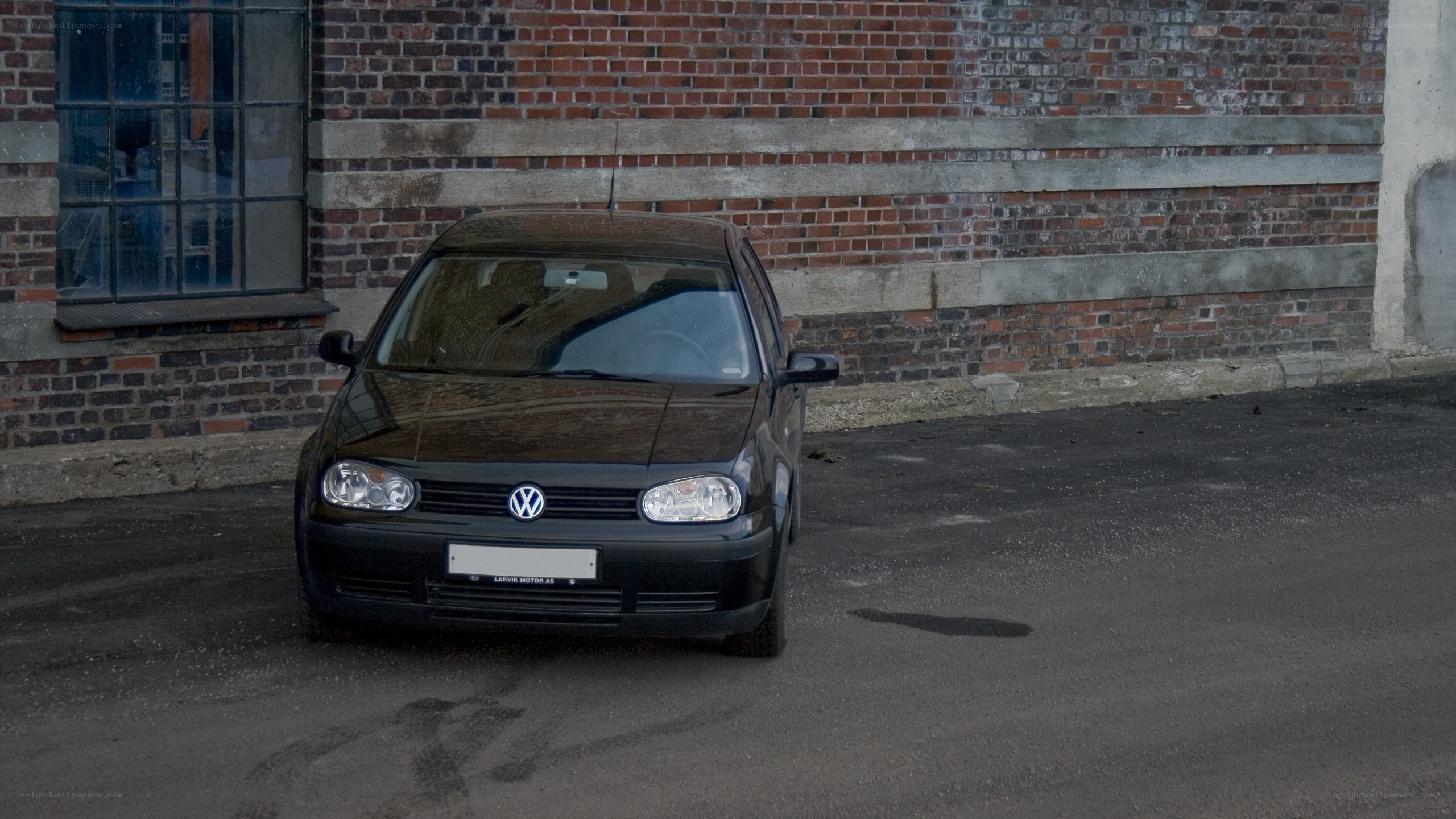 Black Volkswagen Golf parked