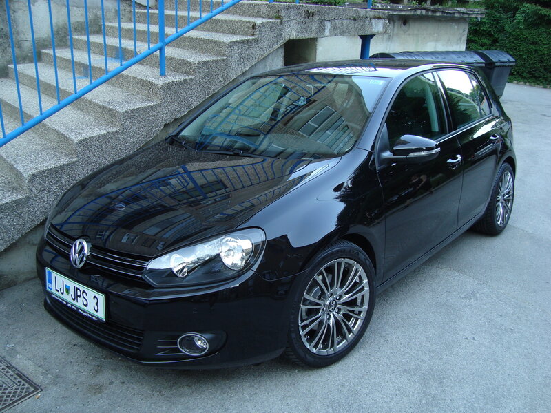 Black Volkswagen Golf parked outside