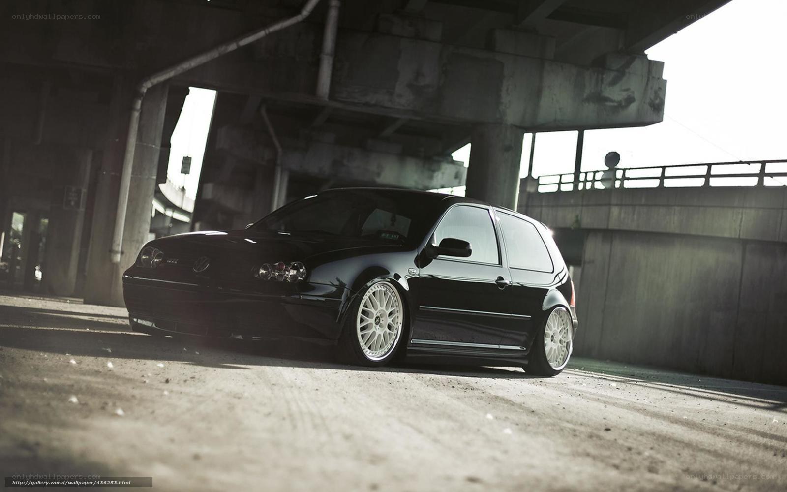 black volkswagen golf under bridge