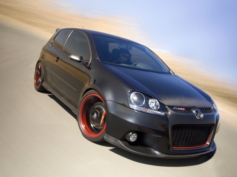 Black Volkswagen GTI in motion