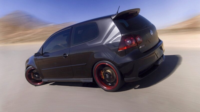 Black Volkswagen GTI in motion