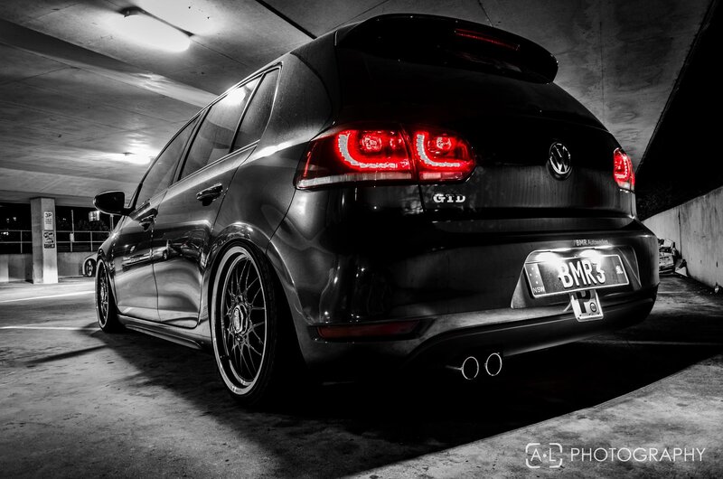 black volkswagen gti in parking garage