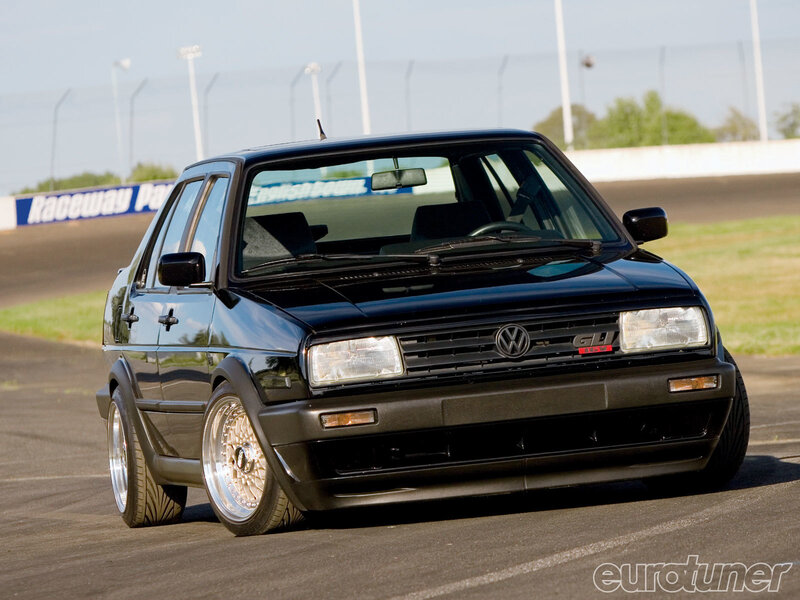 Black Volkswagen GTI on racetrack