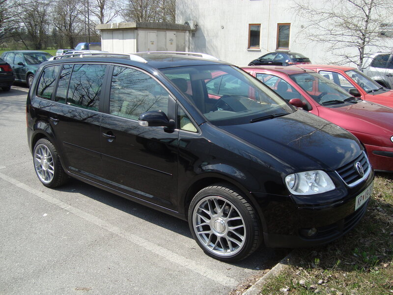 black volkswagen in parking lot