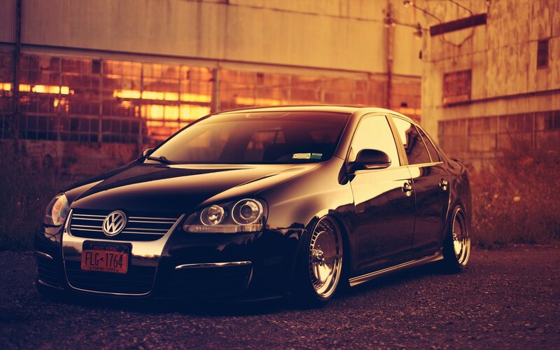 black volkswagen jetta in industrial setting