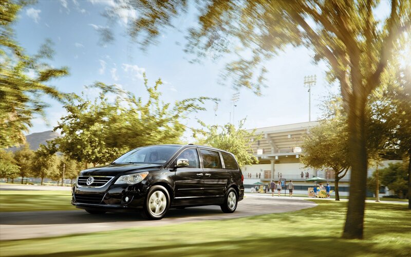 Black Volkswagen minivan on a sunny day