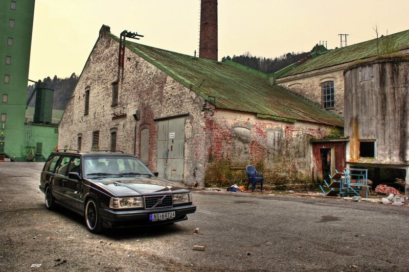 Black Volvo in an old industrial yard