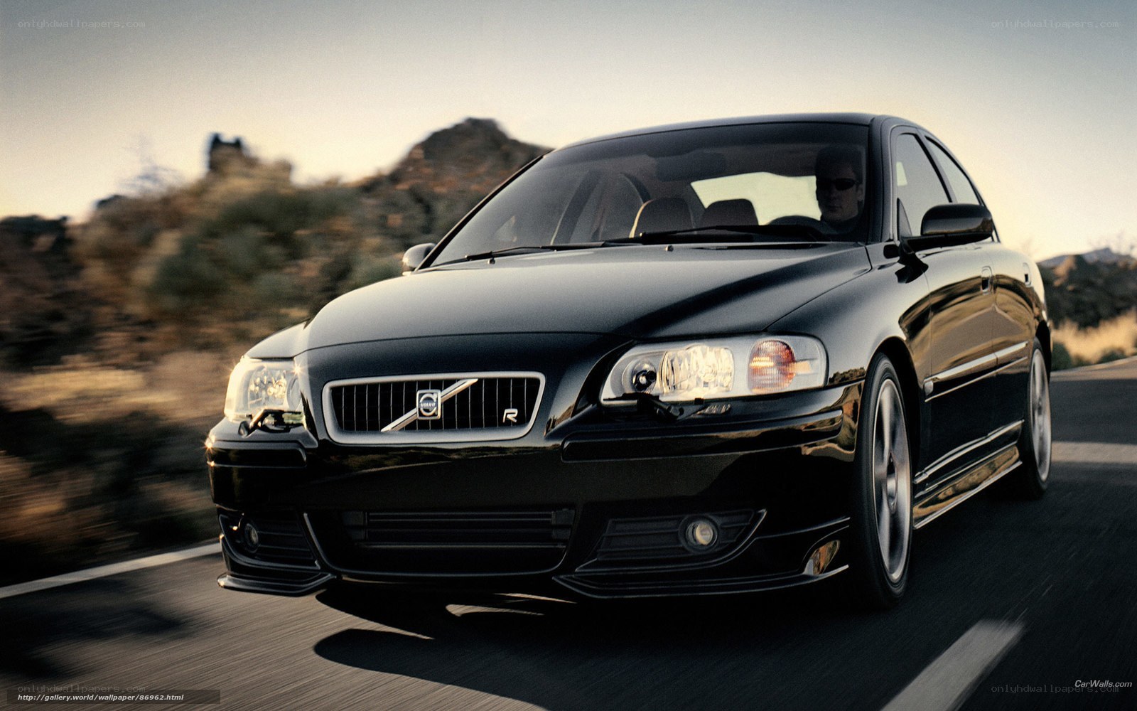 black volvo on desert road