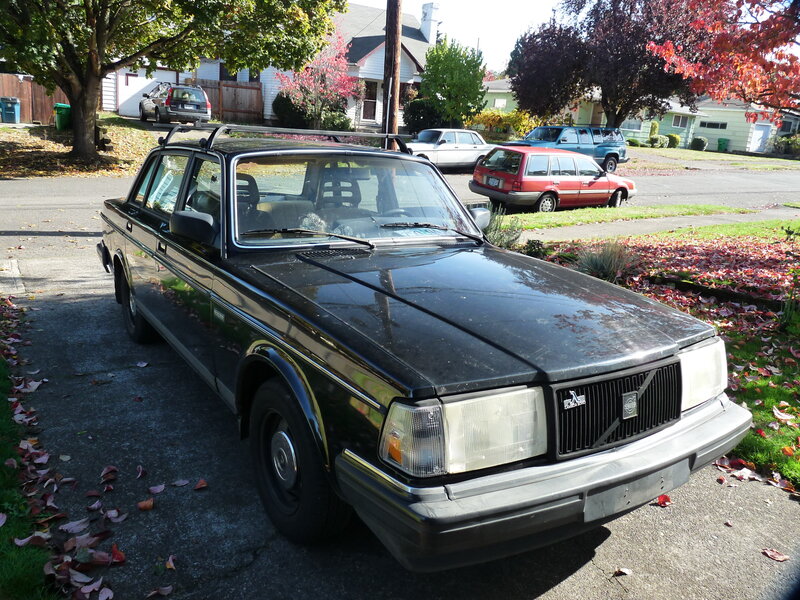 Black Volvo sedan in driveway