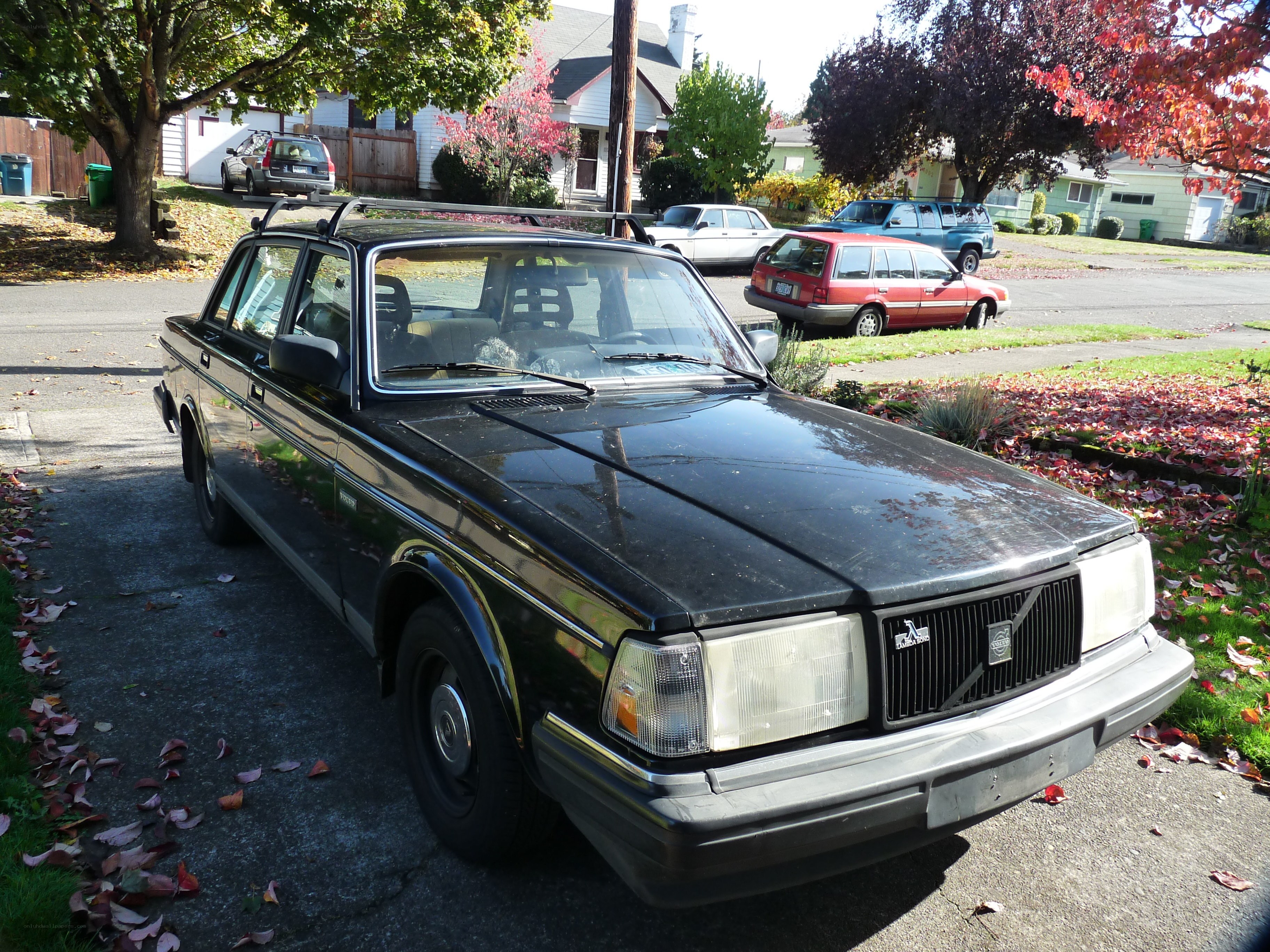 Black Volvo sedan in driveway